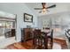 Elegant dining room featuring hardwood floors, natural light, and stylish decor at 8101 S San Juan Range Rd, Littleton, CO 80127