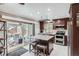 Modern kitchen with stainless steel appliances, granite countertops, and an island with seating at 8101 S San Juan Range Rd, Littleton, CO 80127