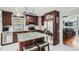Stylish kitchen with granite counters, stainless steel appliances, and an island with barstool seating at 8101 S San Juan Range Rd, Littleton, CO 80127