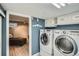 Bright laundry room with modern washer and dryer units, conveniently located at 8101 S San Juan Range Rd, Littleton, CO 80127