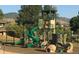 A newly built playground includes slides, climbing features, and swings with mountain views at 8101 S San Juan Range Rd, Littleton, CO 80127