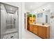 Bathroom features a walk-in shower, dual sink vanity and tile floor at 32392 Lodgepole Dr, Evergreen, CO 80439
