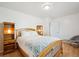 Bright bedroom with hardwood floors and a view at 32392 Lodgepole Dr, Evergreen, CO 80439
