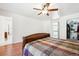 Bedroom featuring ceiling fan, adjacent bathroom and large closet at 32392 Lodgepole Dr, Evergreen, CO 80439