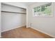 Walk-in closet featuring hardwood floors and natural lighting at 32392 Lodgepole Dr, Evergreen, CO 80439