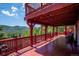 Multi-level deck showcases picturesque mountain views for the perfect outdoor escape at 32392 Lodgepole Dr, Evergreen, CO 80439