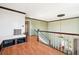 Bright hallway with hardwood floors, crown molding and staircase at 32392 Lodgepole Dr, Evergreen, CO 80439