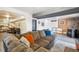 Spacious living room with comfortable seating and access to dining area at 32392 Lodgepole Dr, Evergreen, CO 80439