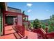 Expansive deck with stunning views, offering plenty of space for outdoor living and entertaining at 32392 Lodgepole Dr, Evergreen, CO 80439