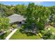 Aerial shot showcasing the home's lush surroundings, mature trees, and beautiful landscaping at 3980 S Dexter St, Cherry Hills Village, CO 80113