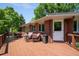Enjoy outdoor living on this spacious back deck with seating, grill and yard views at 3980 S Dexter St, Cherry Hills Village, CO 80113