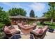Backyard patio featuring a fire pit and seating, great for outdoor entertaining at 3980 S Dexter St, Cherry Hills Village, CO 80113