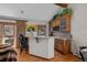 Bar area features seating, granite countertops, and custom cabinetry at 3980 S Dexter St, Cherry Hills Village, CO 80113
