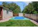Backyard basketball court adjacent to house, perfect for recreational play and outdoor activities at 3980 S Dexter St, Cherry Hills Village, CO 80113