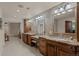 Bathroom offers double vanities, granite countertops, and plenty of storage at 3980 S Dexter St, Cherry Hills Village, CO 80113