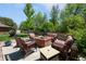 Relax around the brick fire pit with comfortable seating in this charming backyard at 3980 S Dexter St, Cherry Hills Village, CO 80113