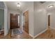 Inviting foyer featuring hardwood floors, a decorative rug, and a solid wood front door at 3980 S Dexter St, Cherry Hills Village, CO 80113