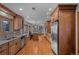 Spacious kitchen with wooden cabinets, stainless steel appliances, and a center island at 3980 S Dexter St, Cherry Hills Village, CO 80113