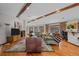 Spacious living room features hardwood floors, comfortable seating, and great natural light at 3980 S Dexter St, Cherry Hills Village, CO 80113