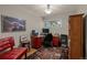 Bright home office with hardwood floors, red desk, stylish area rug, and ample workspace at 3980 S Dexter St, Cherry Hills Village, CO 80113
