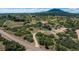 Expansive acreage features a long private drive leading to a beautiful two-story home, horse barn, and riding area at 3488 Dawson Rd, Sedalia, CO 80135