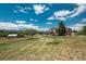 Expansive backyard with mature trees, gazebo and deck space offering ample space for recreation and enjoying nature at 3488 Dawson Rd, Sedalia, CO 80135