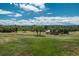 Large, grassy backyard with mature trees, perfect for outdoor activities and enjoying the natural surroundings at 3488 Dawson Rd, Sedalia, CO 80135