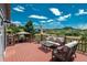 Expansive deck with gazebo, lounge furniture, and stunning views of the surrounding landscape at 3488 Dawson Rd, Sedalia, CO 80135
