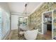 Elegant dining room with a round table, sliding doors to the exterior, and stylish wallpaper at 3488 Dawson Rd, Sedalia, CO 80135