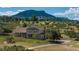 Stunning two-story home with lush landscaping, complemented by a scenic mountain view and a private driveway at 3488 Dawson Rd, Sedalia, CO 80135