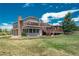 Large two-story home features an expansive deck and gazebo for outdoor living in the tranquil backyard at 3488 Dawson Rd, Sedalia, CO 80135