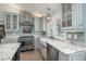 Kitchen featuring stainless appliances, granite countertops, a farmhouse sink, and custom tile backsplash at 3488 Dawson Rd, Sedalia, CO 80135