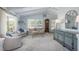 Sophisticated living room with vaulted ceilings, showcasing stylish furnishings, neutral colors, and an antique grandfather clock at 3488 Dawson Rd, Sedalia, CO 80135