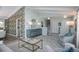 Comfortable living room featuring vaulted ceilings, stylish furniture, designer wallpaper and an adorable cat at 3488 Dawson Rd, Sedalia, CO 80135