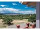 Scenic mountain views from the deck, surrounded by lush greenery and a beautiful blue sky at 3488 Dawson Rd, Sedalia, CO 80135