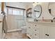 Modern bathroom with double vanity, stylish fixtures, and a tiled walk-in shower at 5149 E Links Cir, Centennial, CO 80122