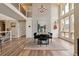 Well-lit dining area features hardwood floors, modern chandelier and open floor plan at 5149 E Links Cir, Centennial, CO 80122