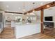 Bright and airy kitchen featuring an island, granite countertops, and stainless steel appliances at 5149 E Links Cir, Centennial, CO 80122