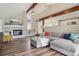 Living room with fireplace, window seat, wood floors, and an open concept layout at 5149 E Links Cir, Centennial, CO 80122