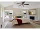 The main bedroom features a decorative fireplace, neutral color palette, and natural light at 5149 E Links Cir, Centennial, CO 80122