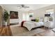 Spacious main bedroom offers a vaulted ceiling, a decorative accent wall, and a ceiling fan at 5149 E Links Cir, Centennial, CO 80122