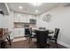 Basement wet bar with stainless steel microwave, beverage fridge, and a poker table at 9882 S Hoyt Ct, Littleton, CO 80127