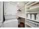 Laundry room with stackable washer and dryer at 9882 S Hoyt Ct, Littleton, CO 80127