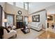 Bright living room featuring vaulted ceilings, large windows, and neutral decor at 9882 S Hoyt Ct, Littleton, CO 80127