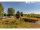 A community park includes playground, pond, and walking paths at 9882 S Hoyt Ct, Littleton, CO 80127