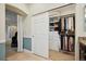 A walk-in closet featuring ample shelving, hanging storage, and a neutral color palette at 9882 S Hoyt Ct, Littleton, CO 80127