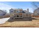 Two-story home featuring a backyard deck, and mature trees at 10053 Granite Hill Dr, Parker, CO 80134