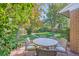 Outdoor seating on the patio in a beautiful backyard with an outdoor table and chairs at 11627 E Virginia Pl, Aurora, CO 80012