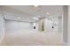 Open basement area with plush carpeting and recessed lighting, leading to a small kitchen area at 3565 New Haven Cir, Castle Rock, CO 80109
