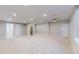 Expansive basement area featuring neutral decor, recessed lighting, and multiple entryways for flexible usage at 3565 New Haven Cir, Castle Rock, CO 80109